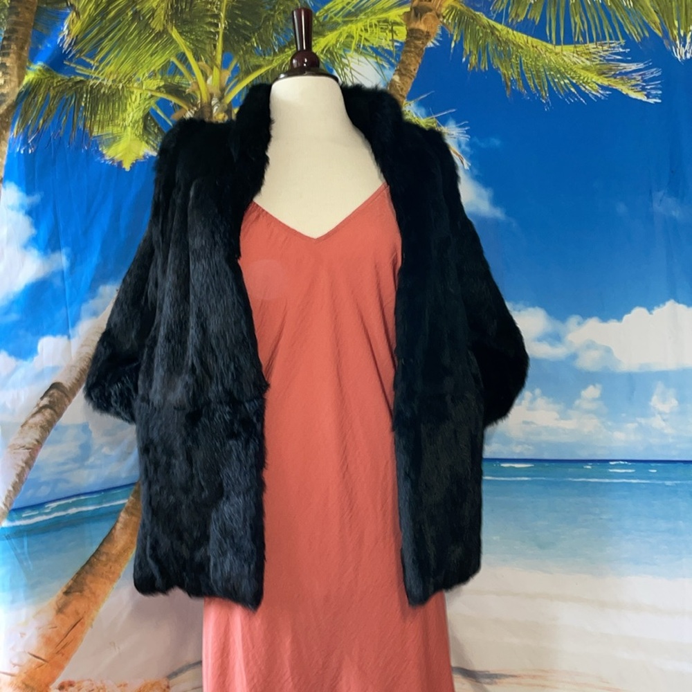 All black fur coat or vest sleeves come off